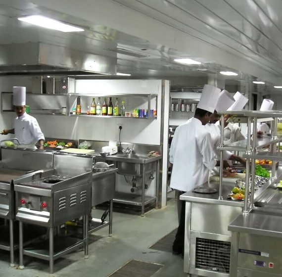 chefs at work in hotel kitchen